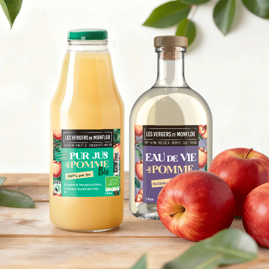 Bouteilles de Pur Jus de Pomme et Eau de Vie "Les Vergers de Monflou" présentées ensemble, création de gamme de packaging alimentaire par Well Com Studio Graphique à Albi.